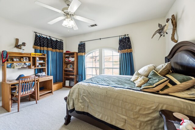 bedroom featuring carpet, a ceiling fan, and visible vents
