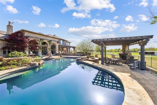 view of swimming pool featuring fence, a fenced in pool, a patio, and a pergola