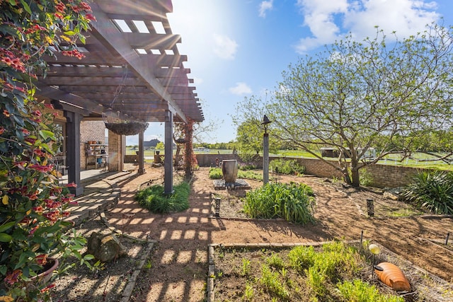 view of yard with a patio, fence, and a pergola