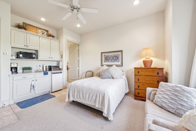 bedroom with recessed lighting, a toaster, light carpet, and fridge