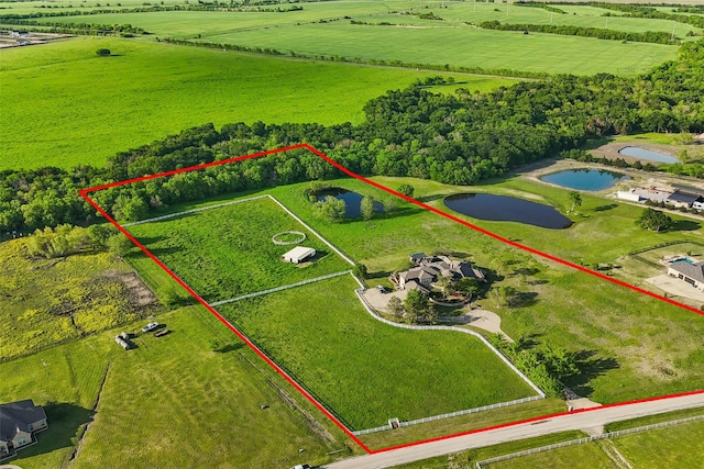 drone / aerial view featuring a water view and a rural view