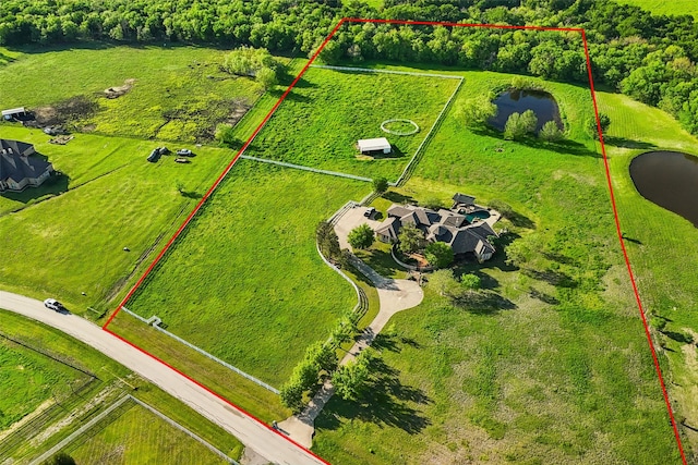 aerial view with a water view and a rural view