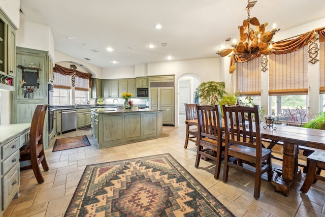 dining area with an inviting chandelier, stone tile floors, visible vents, recessed lighting, and arched walkways