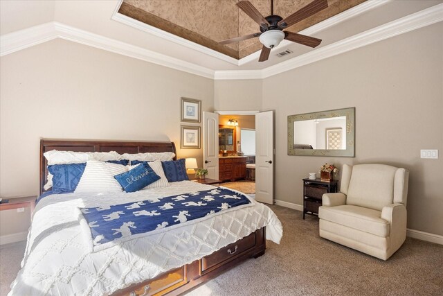 carpeted bedroom with a tray ceiling, visible vents, ornamental molding, and baseboards