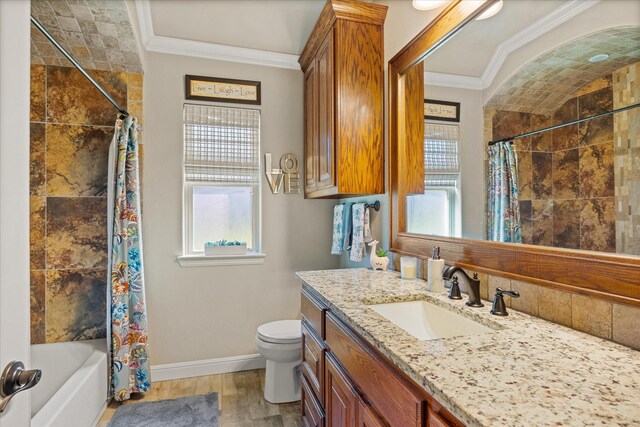 bathroom with wood finished floors, baseboards, toilet, ornamental molding, and shower / bathtub combination with curtain