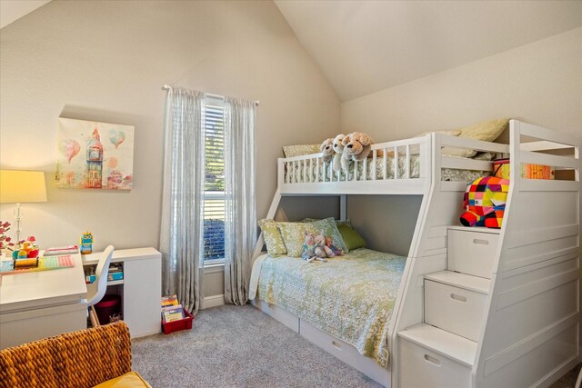 bedroom with carpet flooring and vaulted ceiling