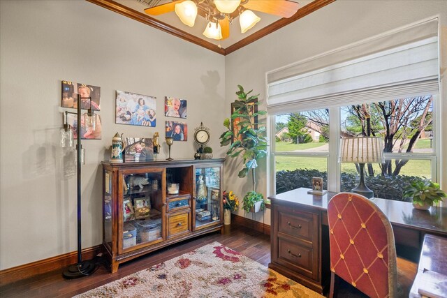 office area featuring crown molding, baseboards, ceiling fan, and dark wood-style floors