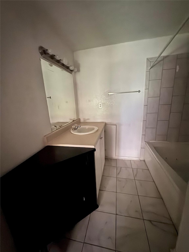 full bath featuring bathtub / shower combination, vanity, and marble finish floor