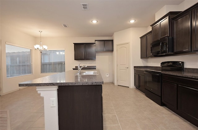 kitchen with a sink, visible vents, a chandelier, black appliances, and light tile patterned floors
