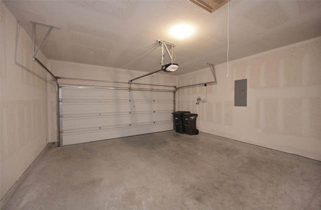 garage featuring electric panel and a garage door opener