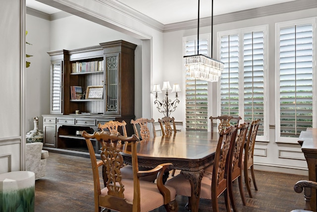 dining space with dark wood-type flooring and crown molding