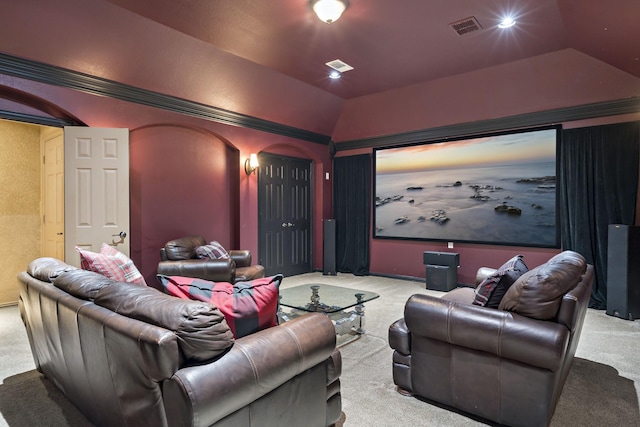 cinema featuring visible vents, carpet flooring, and lofted ceiling
