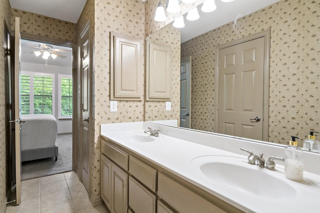 full bath with a sink, wallpapered walls, and ensuite bathroom