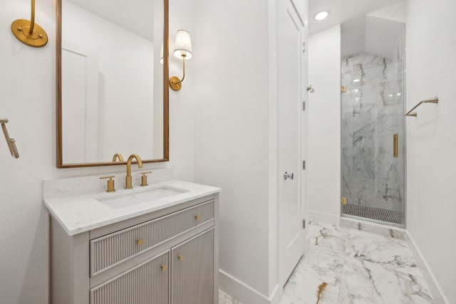 2016 Portofino Dr, Rockwall, TX 75032 - bathroom with baseboards, marble finish floor, vanity, and a marble finish shower