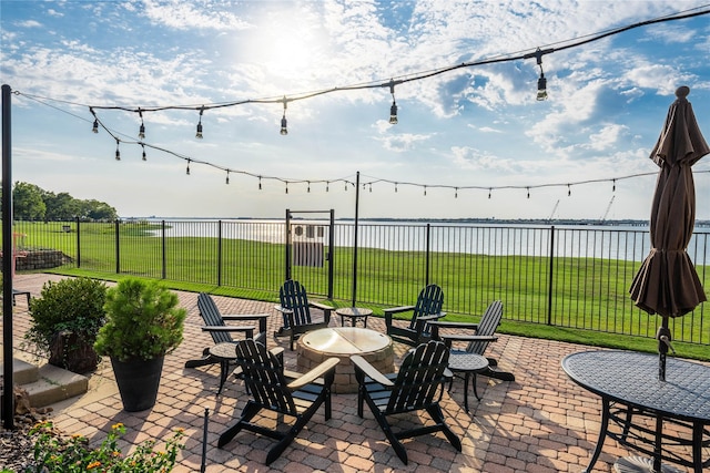 2016 Portofino Dr, Rockwall, TX 75032 - view of patio featuring a water view, an outdoor fire pit, and fence