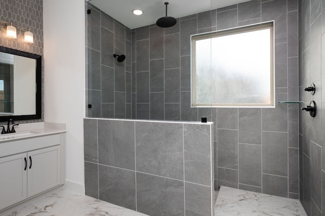 full bath featuring walk in shower, marble finish floor, and vanity