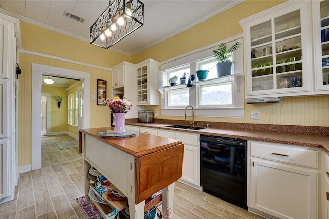 kitchen with visible vents, ornamental molding, a sink, and black dishwasher