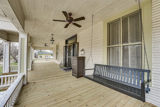 deck featuring a ceiling fan and a porch