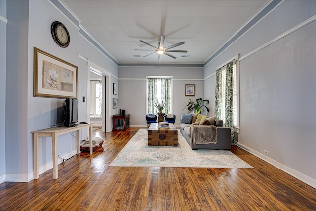 living room with crown molding and dark wood-style floors