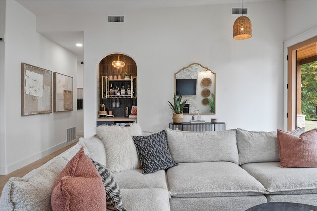 kitchen featuring gray cabinetry, freestanding refrigerator, backsplash, and white microwave