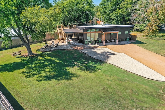back of property featuring a patio, a yard, stairway, and a deck