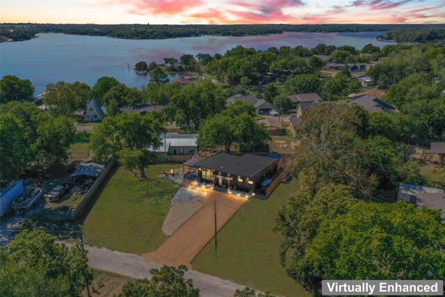 view of front of house with a patio and fence