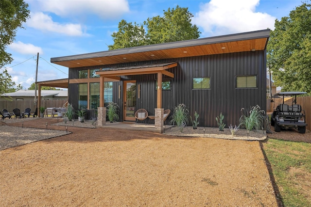 back of house featuring fence and a patio area