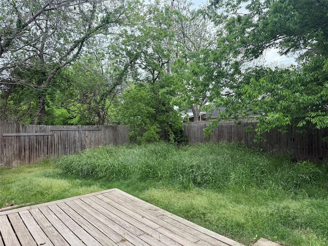 deck with a fenced backyard