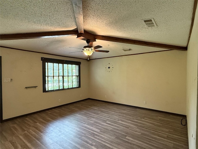 unfurnished room with wood finished floors, visible vents, beam ceiling, and a ceiling fan