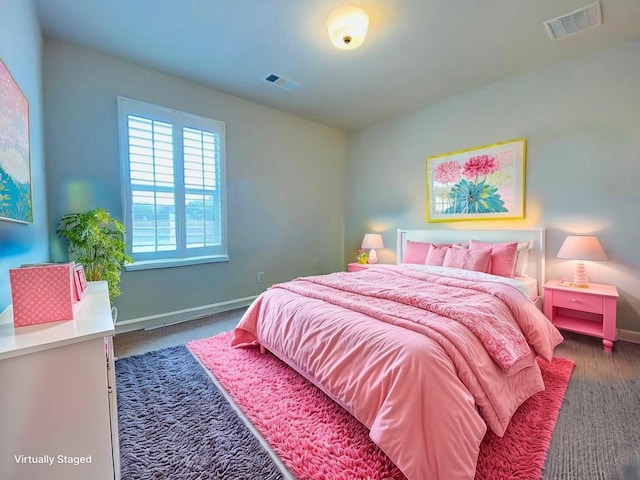 bedroom featuring visible vents, carpet flooring, and baseboards