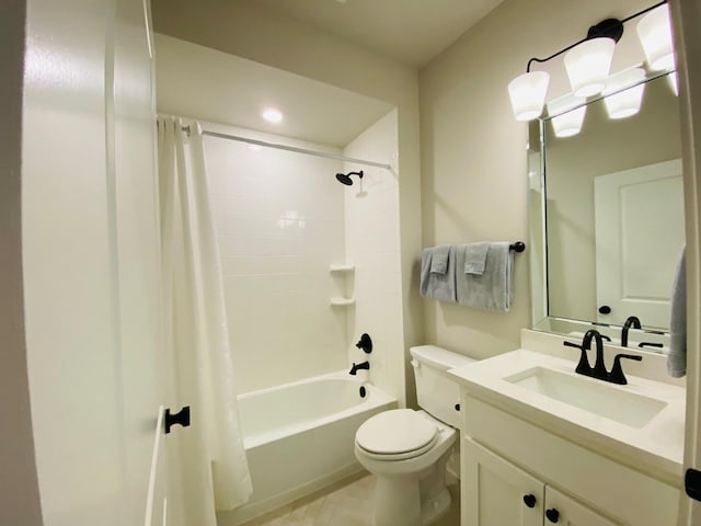 bathroom featuring shower / bath combo, toilet, and vanity