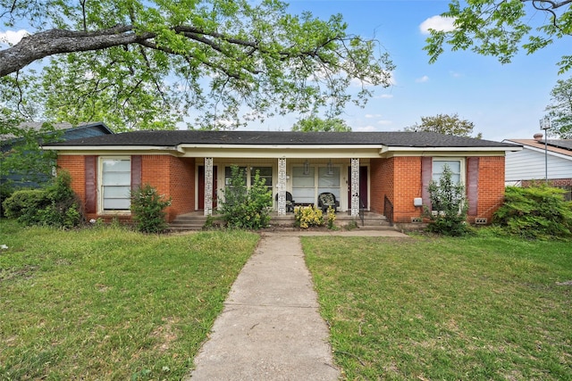 3717 Parkwood St, Waco, TX 76710 - single story home featuring brick siding, a porch, and a front yard