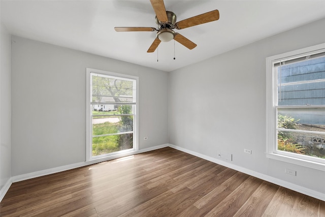 3717 Parkwood St, Waco, TX 76710 - spare room with baseboards, wood finished floors, ceiling fan, and a healthy amount of sunlight