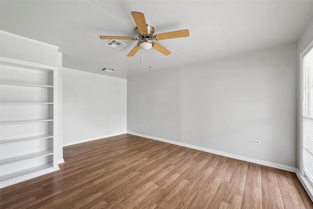 3717 Parkwood St, Waco, TX 76710 - unfurnished room with wood finished floors, visible vents, a ceiling fan, and baseboards