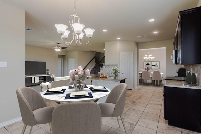dining area with recessed lighting, stairs, visible vents, and ceiling fan with notable chandelier