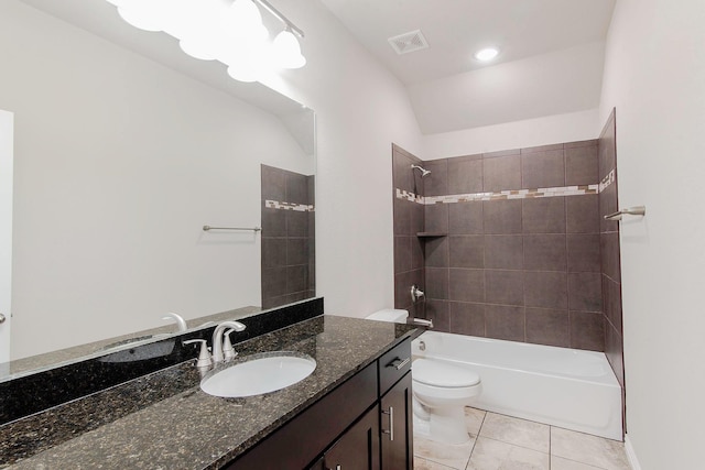 bathroom with washtub / shower combination, tile patterned floors, visible vents, toilet, and vanity