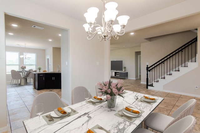 dining space with visible vents, recessed lighting, a notable chandelier, and stairway