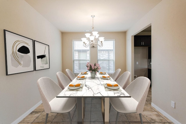 dining area with visible vents, baseboards, and an inviting chandelier