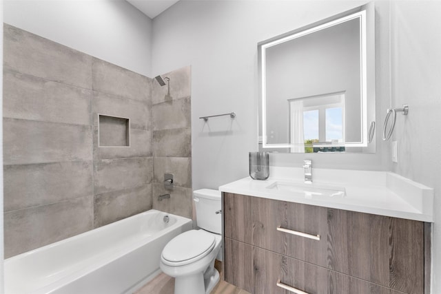 full bath featuring vanity, bathing tub / shower combination, and toilet