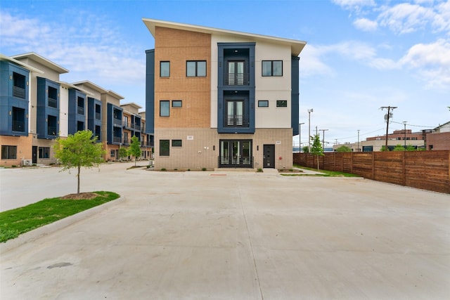 view of building exterior featuring fence