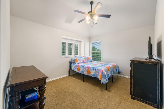 bedroom featuring lofted ceiling, baseboards, carpet, and ceiling fan