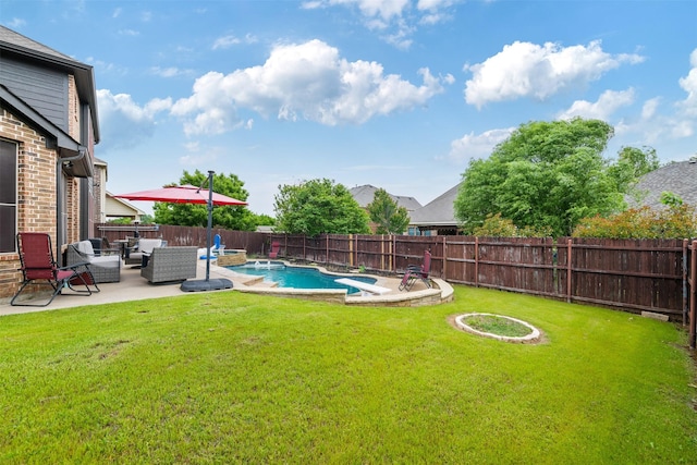 view of yard with outdoor lounge area, a fenced in pool, a patio, and a fenced backyard