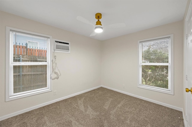 carpeted empty room with baseboards, ceiling fan, and a wall unit AC