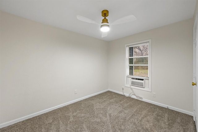 carpeted spare room with baseboards, a ceiling fan, and cooling unit