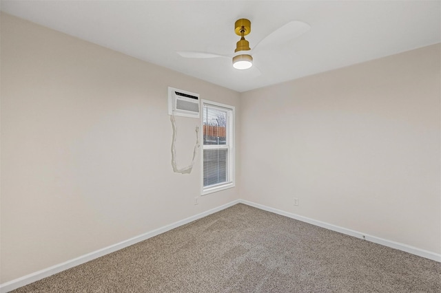 unfurnished room with a wall mounted AC, a ceiling fan, baseboards, and carpet