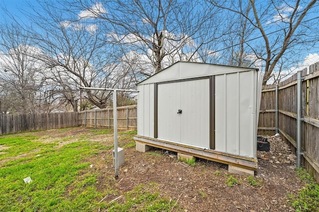 view of shed featuring a fenced backyard