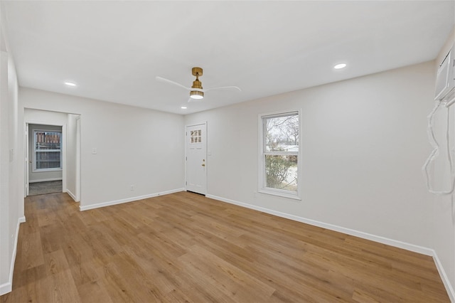 interior space with recessed lighting, light wood-style flooring, baseboards, and ceiling fan