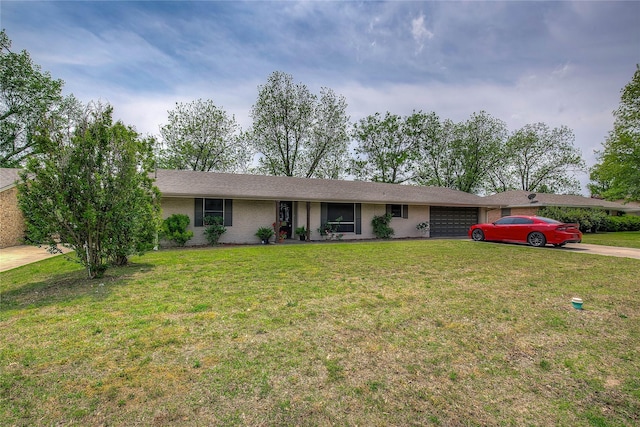 ranch-style house with brick siding, an attached garage, driveway, and a front lawn