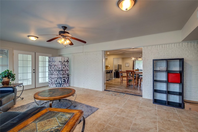 living room with ceiling fan, french doors, and light tile patterned floors
