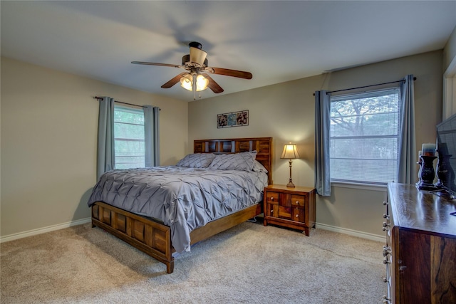 bedroom featuring baseboards, a ceiling fan, and carpet flooring